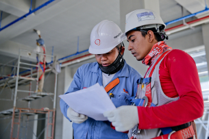 workers speaking industrial work